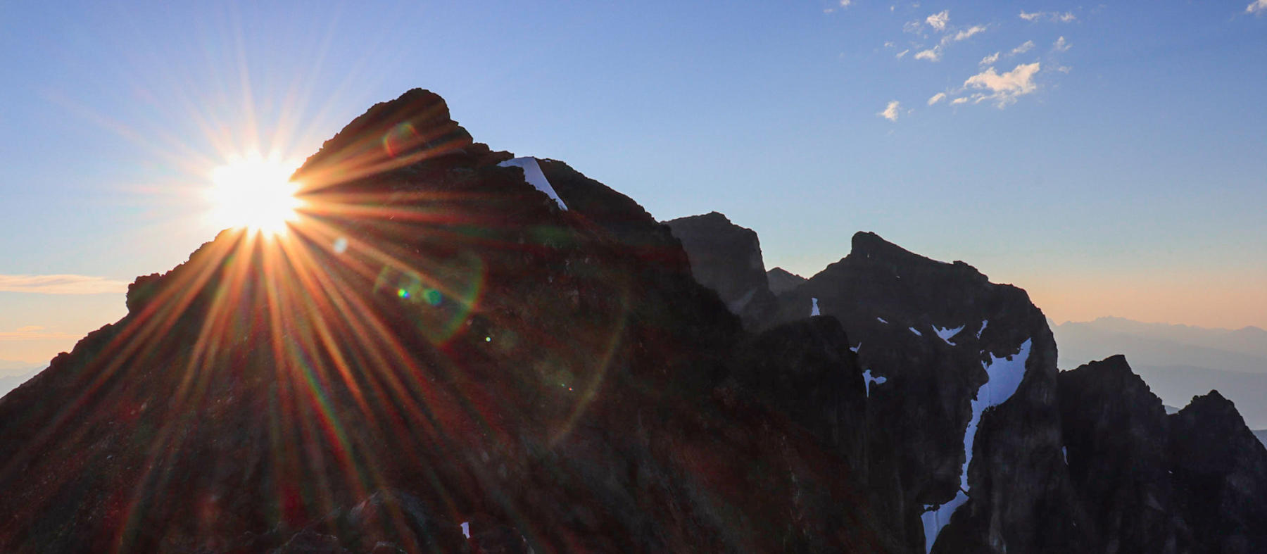 Hudson Bay Mountain, Smithers, BC sunburst over alpine ridge